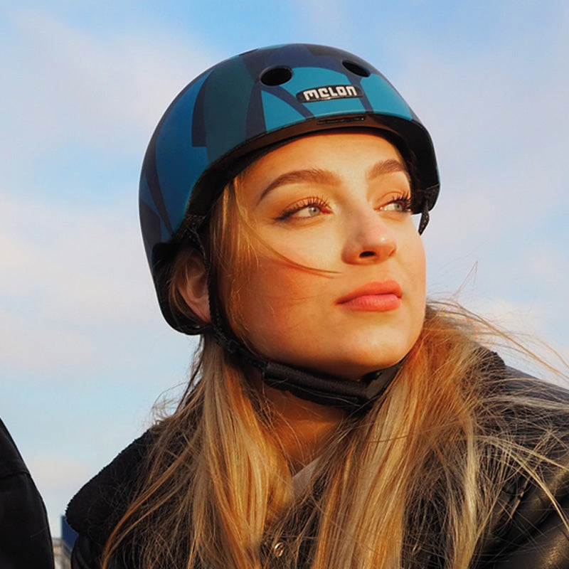 Girl wearing a blue Melon Frozen Lake helmet at the Hamburg Docks