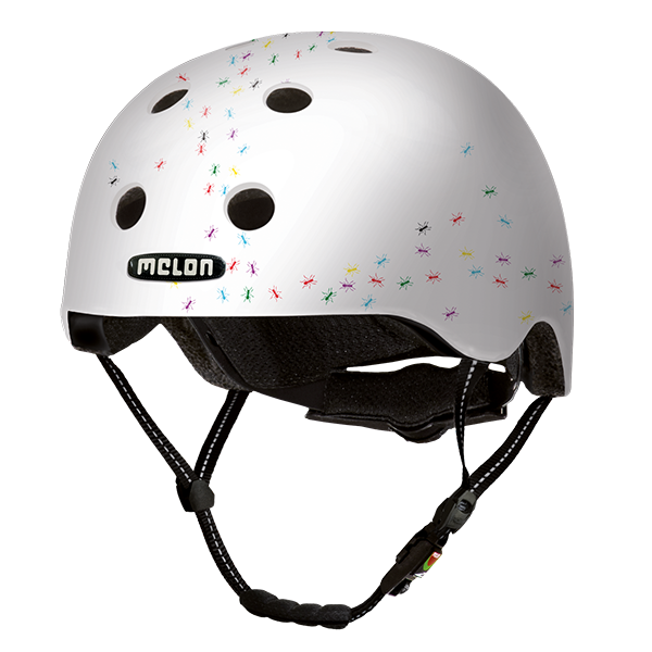 White Bicycle Helmets with lots of small colourful ants design crawling through the ventilation holes