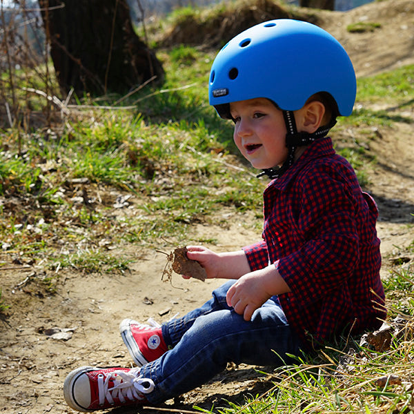 Toddler wearing a blue Melon Baby Helmet